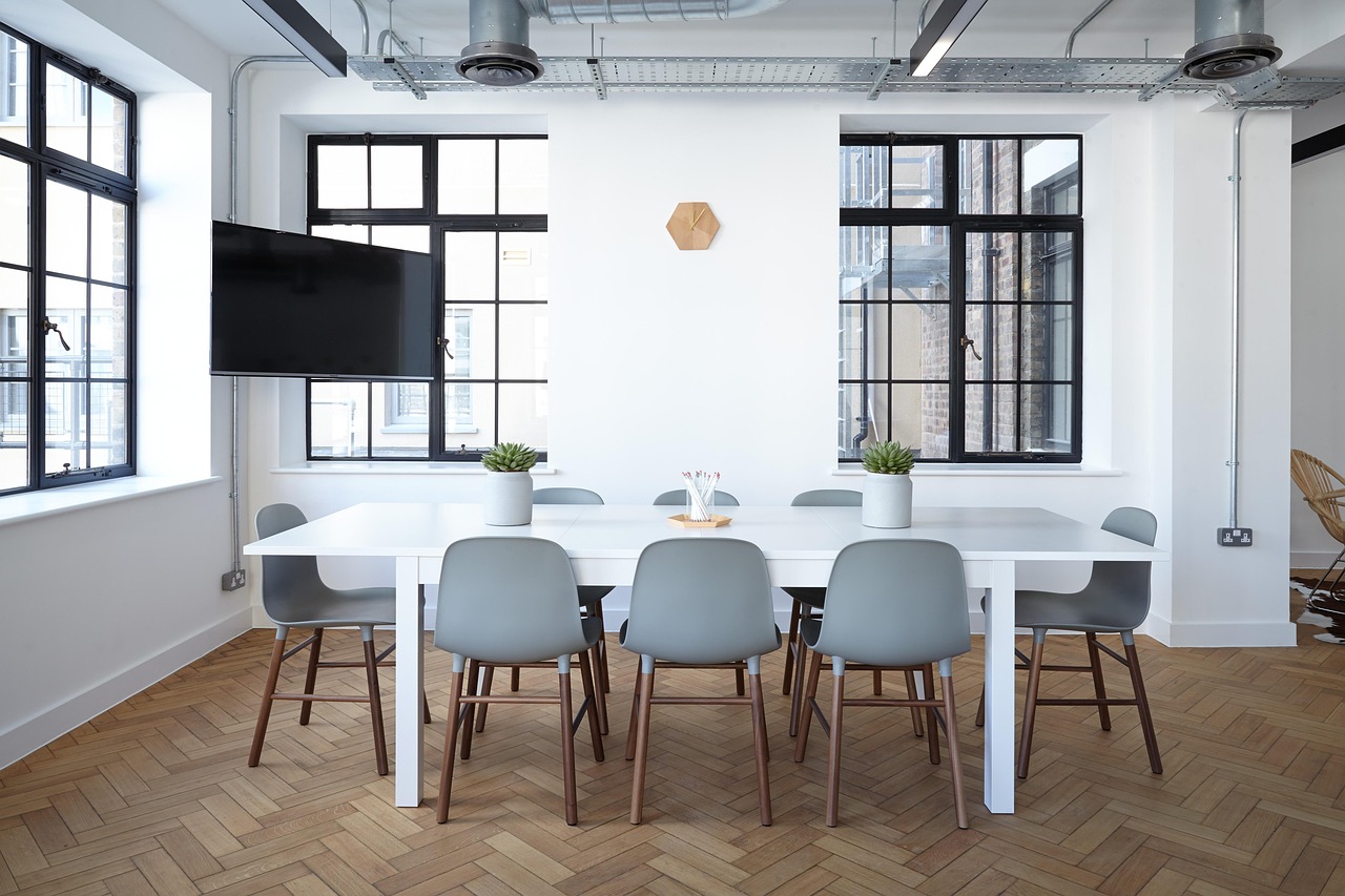 A calm, modern meeting room, the central point a multi-country programme runs from.